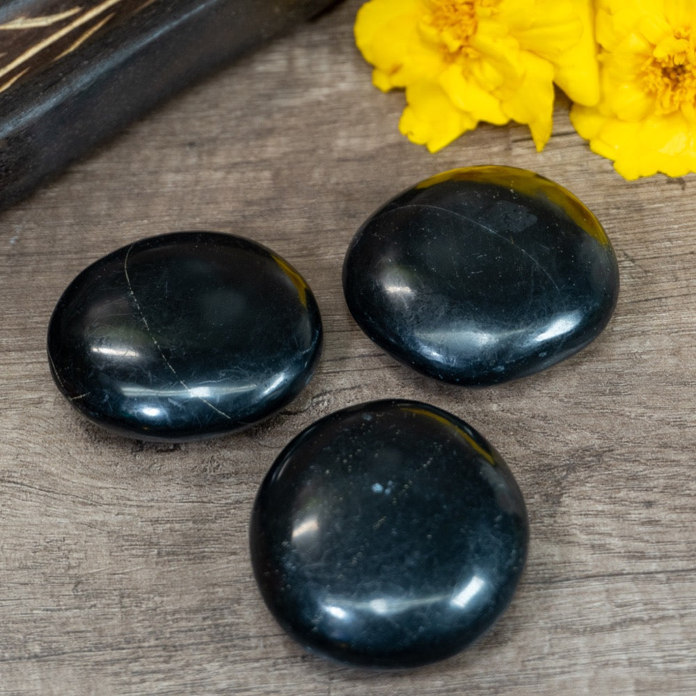 smooth, palm sized, flat, round black onyx stones
