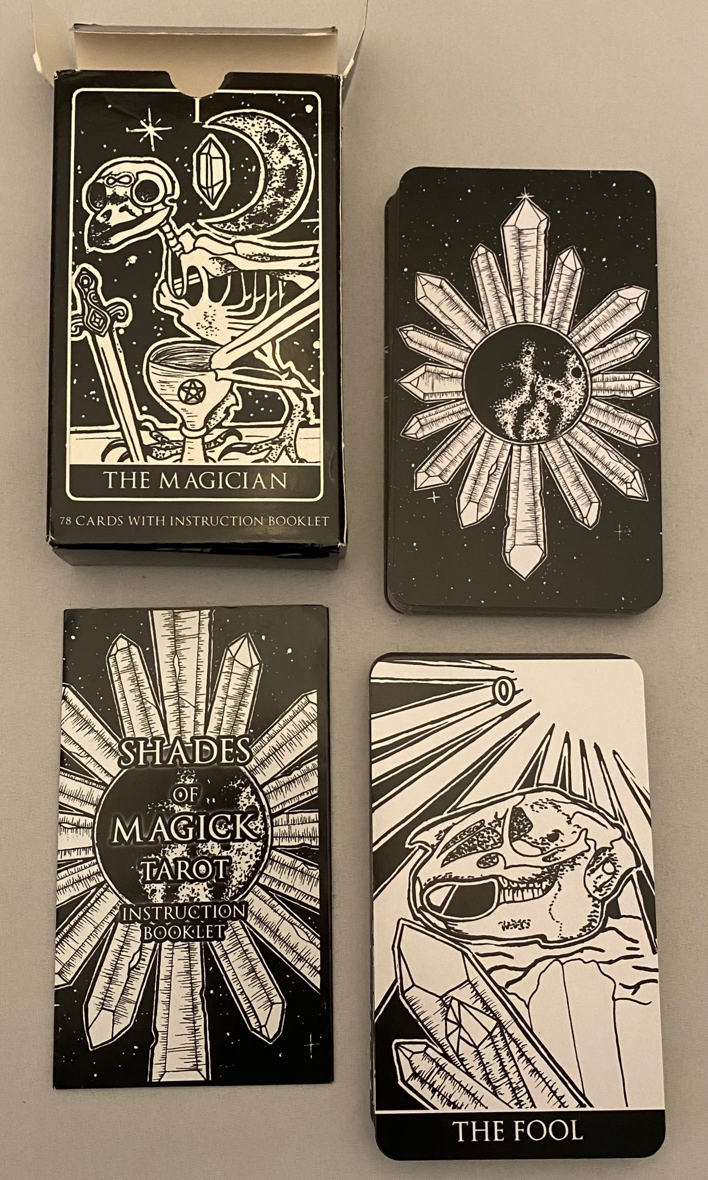 Four tarot cards from 'Shades of Magick' tarot set on a neutral background