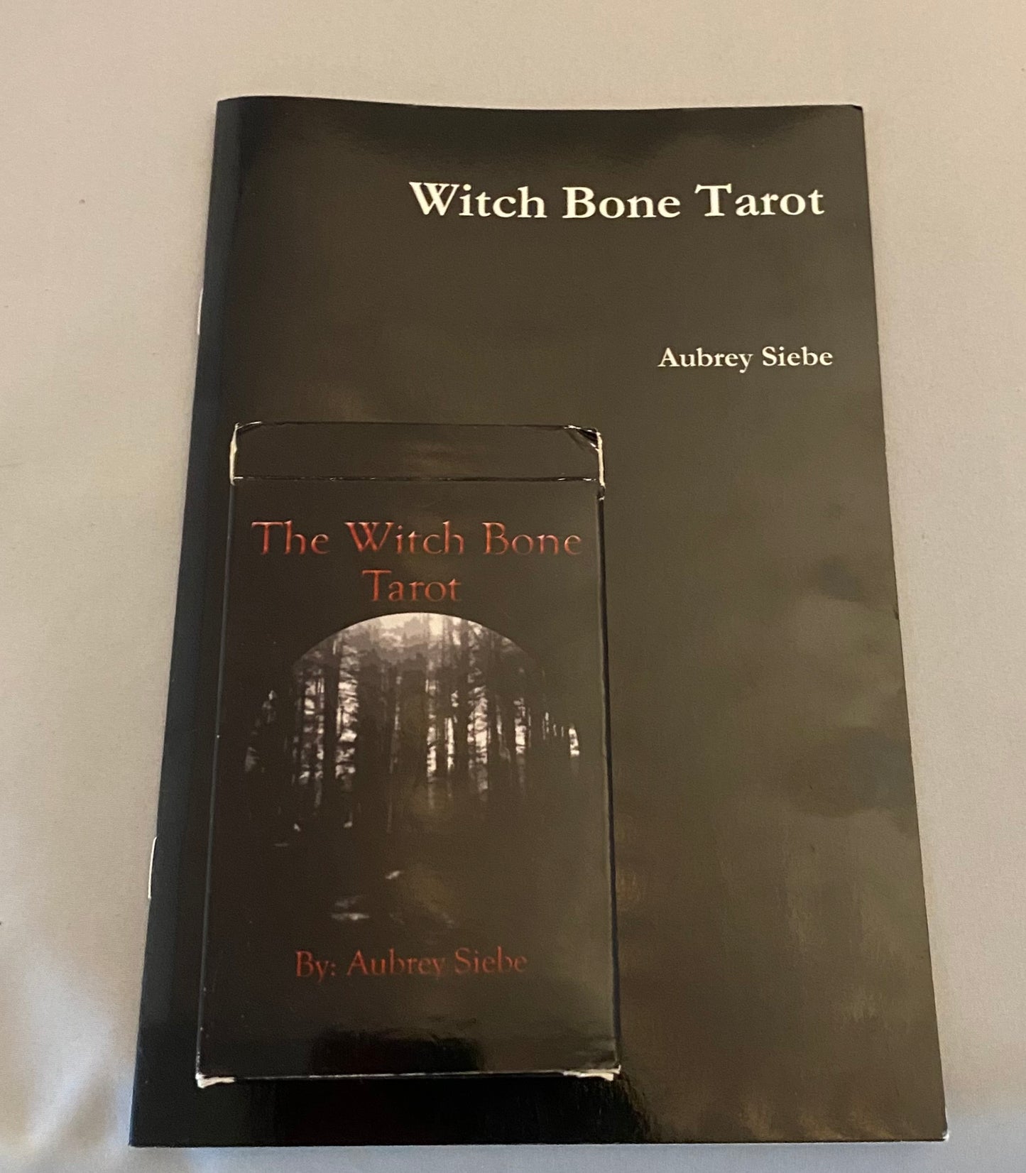 Book titled 'Witch Bone Tarot' by Aubrey Siebe on a white background