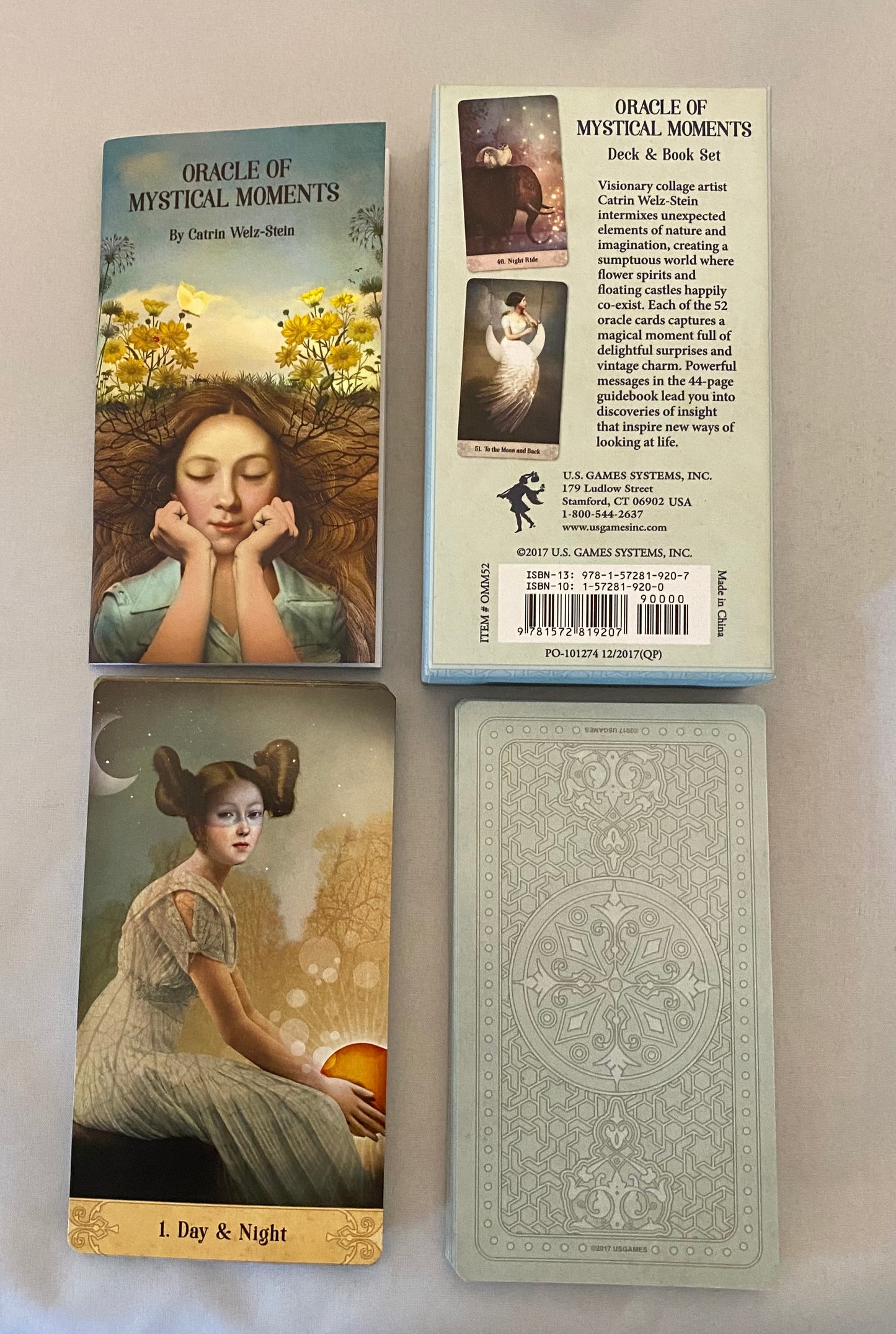 Oracle cards with a woman's portrait and nature elements on a neutral background