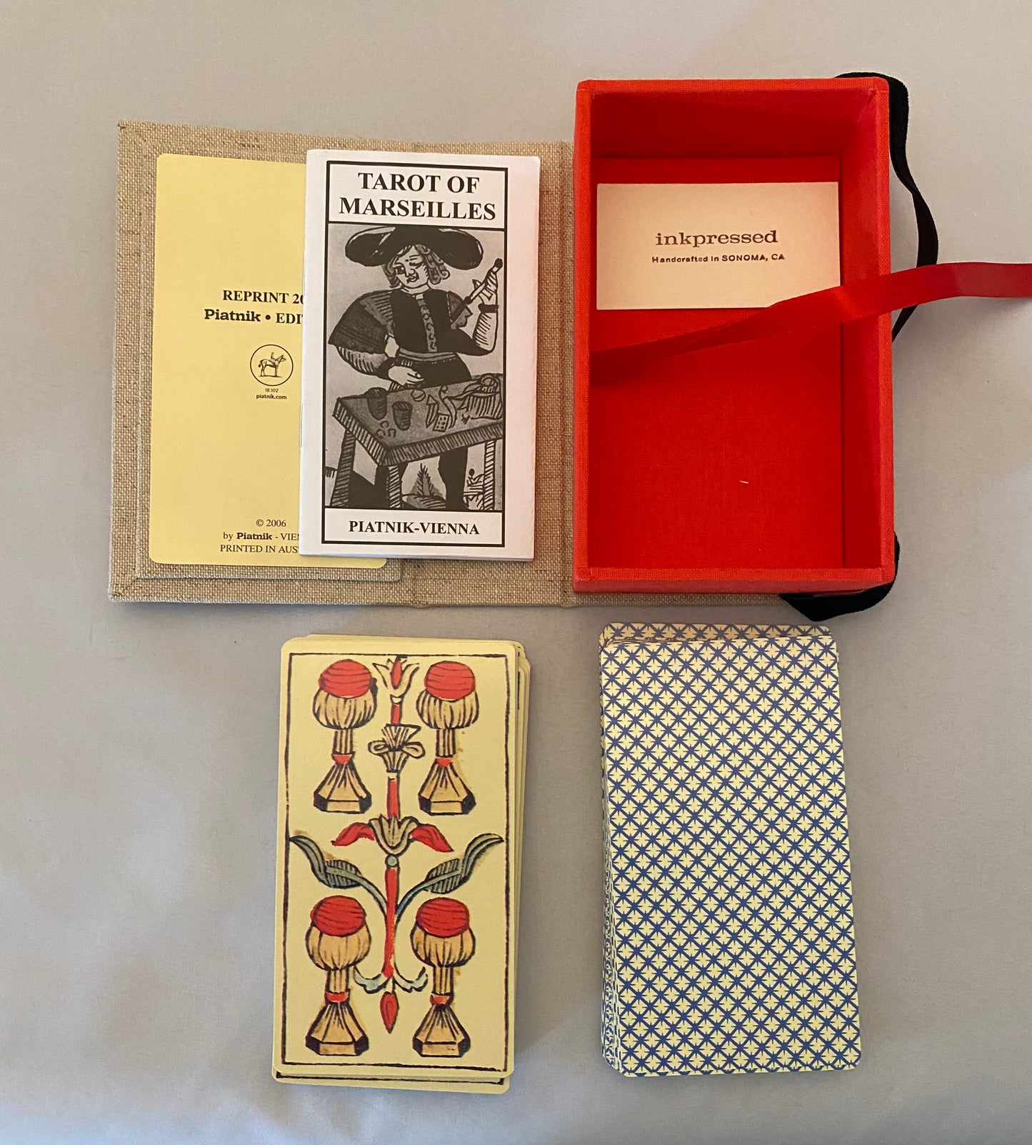 Tarot of Marseilles deck with packaging and card showing symbols
