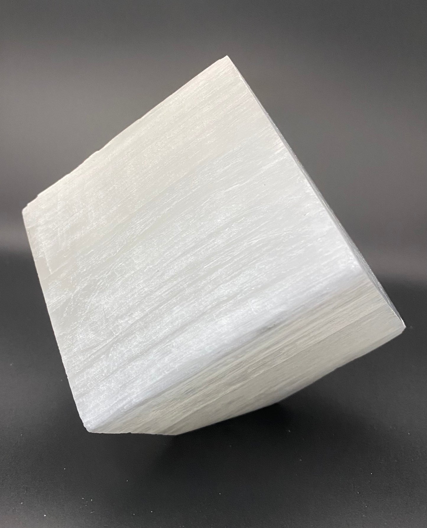 White geometric solid object on a gray background