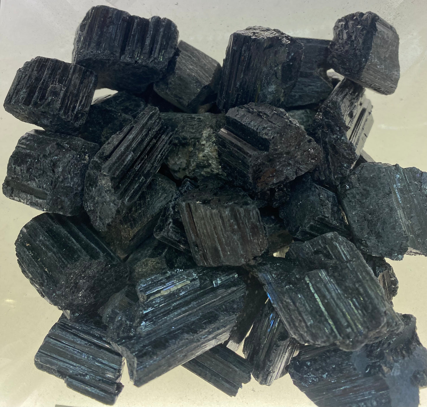 Stack of black rectangular stones on a light gray background