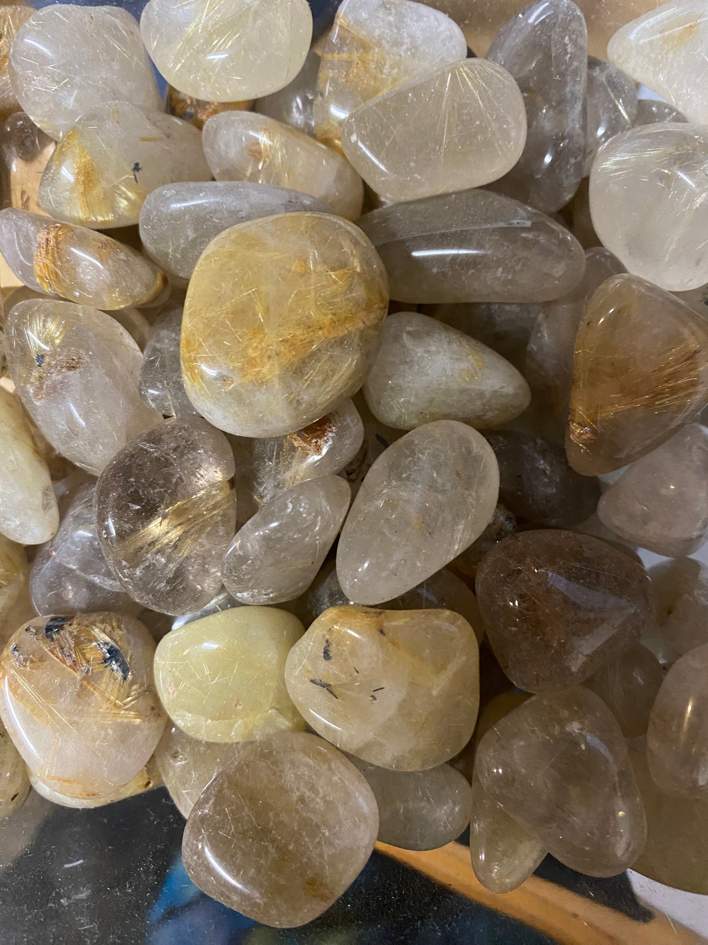 Collection of translucent stones with various colors on a dark background