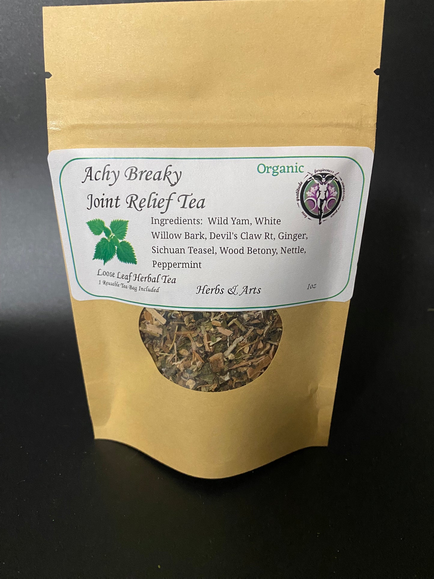 Achy Breaky Joint Relief Tea Organic Kraft tea bag on a black background.