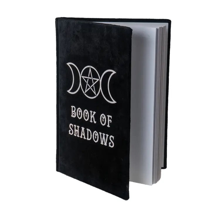 Black notebook titled 'Book of Shadows' with a pentacle symbol on a white background