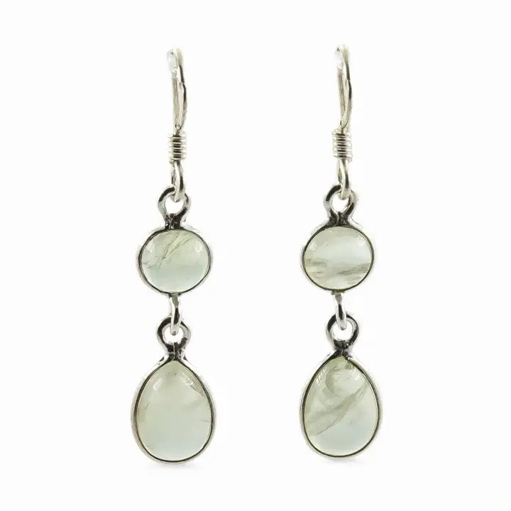 Pair of silver earrings with green gemstones on a white background