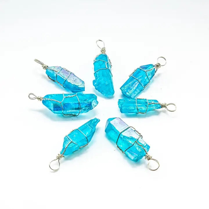 Set of blue crystal pendants on a white background