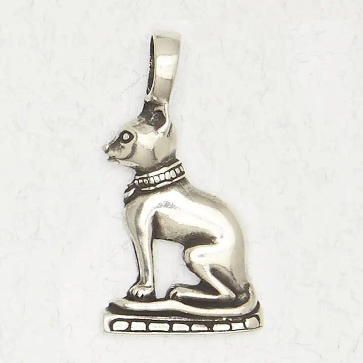 Silver cat-shaped pendant on a white background