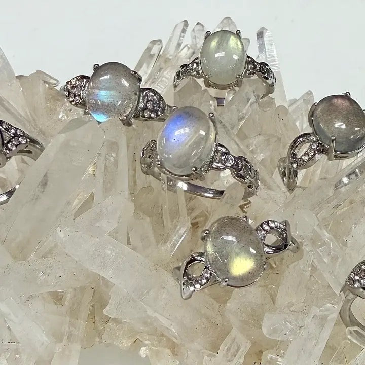 Silver rings with gemstones on a crystal background