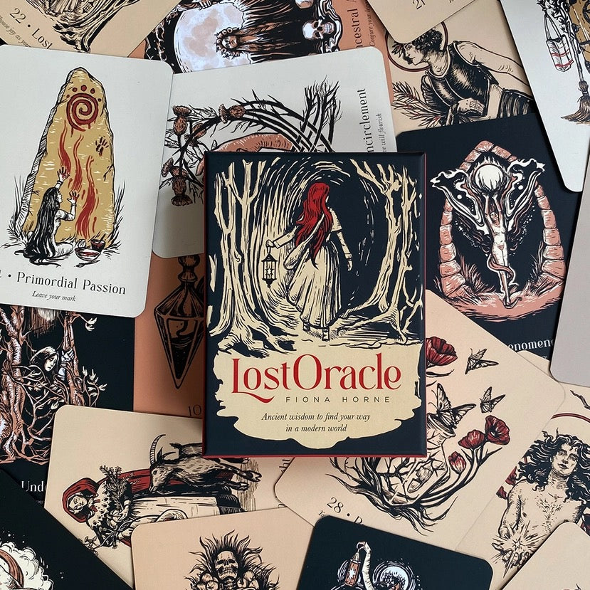 Collection of oracle cards with 'Lost Oracle' book in the center