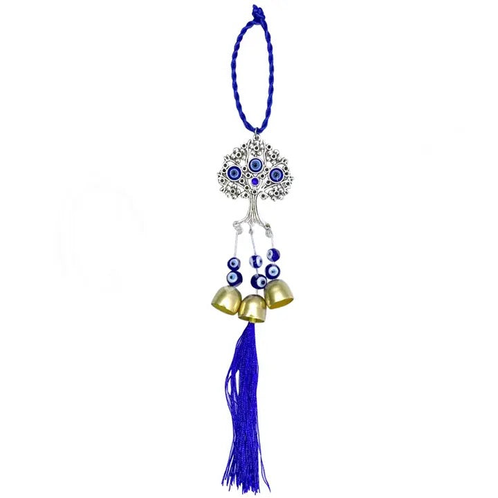 Decorative hanging ornament with blue tassel, gold bells, and blue beads on a white background