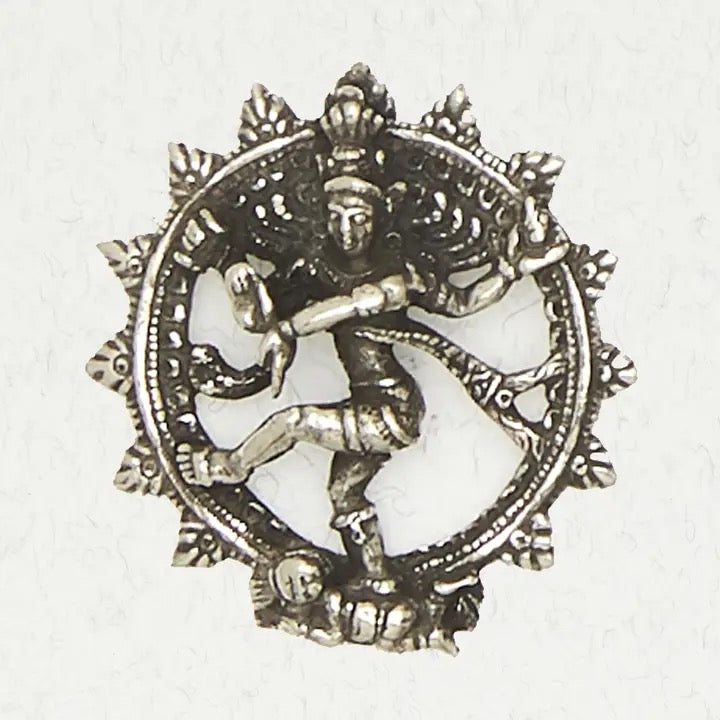 Decorative pewter emblem with a central figure on a white background