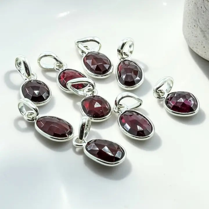 Assorted Pendant Garnet Faceted on a white background