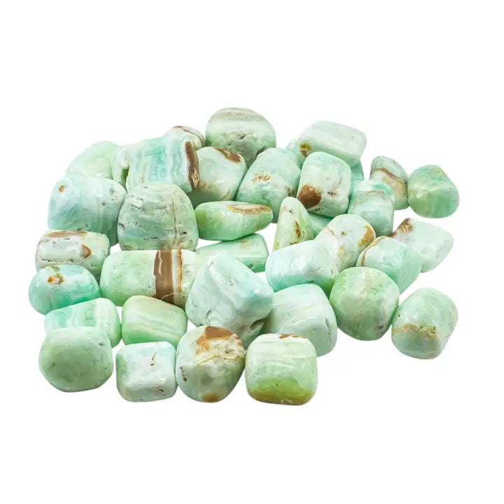 Greenish stones with brown spots on a white background