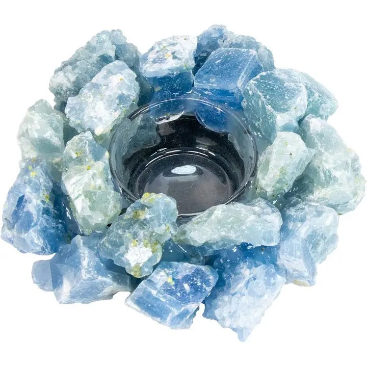 Decorative candle holder with blue crystal-like stones on a white background