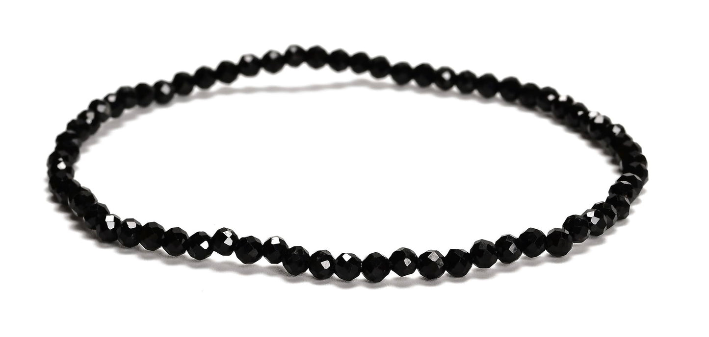 Black beaded necklace on a white background