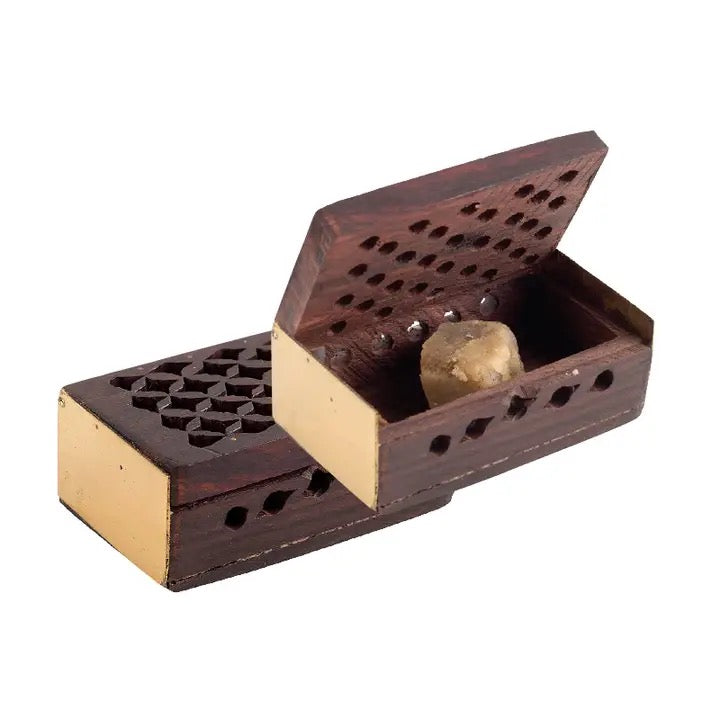 Wooden incense burner with a stone on a white background