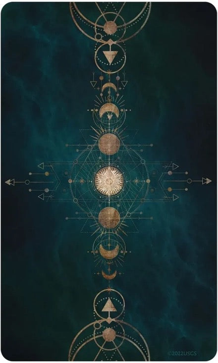 Card back with celestial design on a dark teal background