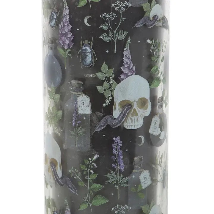 Tumbler with skull and nature design on a black background