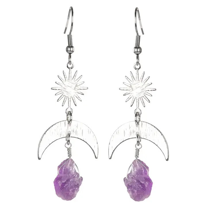 Pair of earrings with purple stones and star and moon designs on a white background