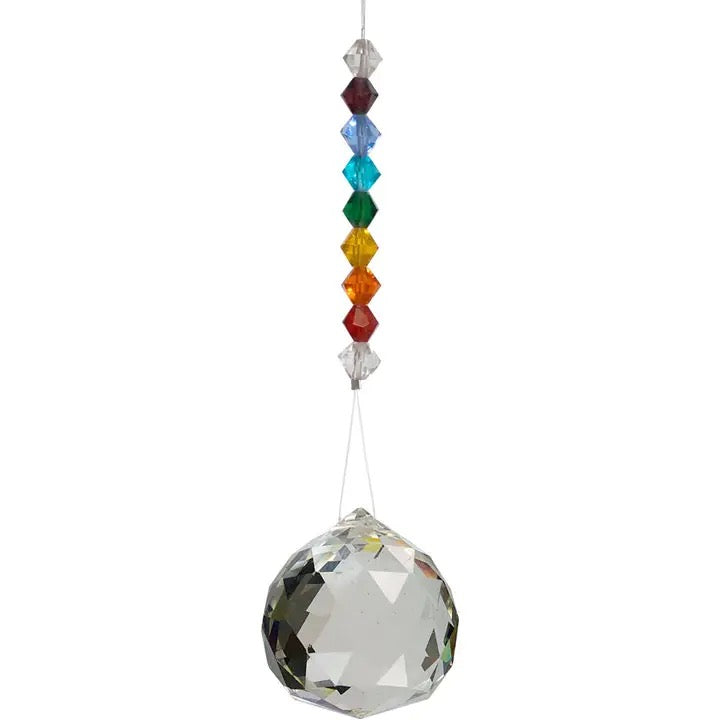 Crystal ball with colorful beads on a white background