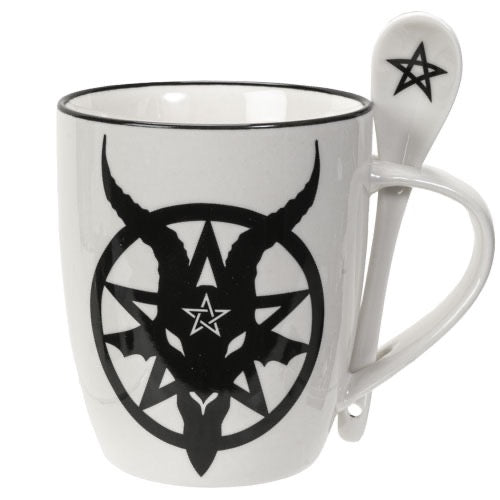 White mug with black symbol design and matching spoon on a white background