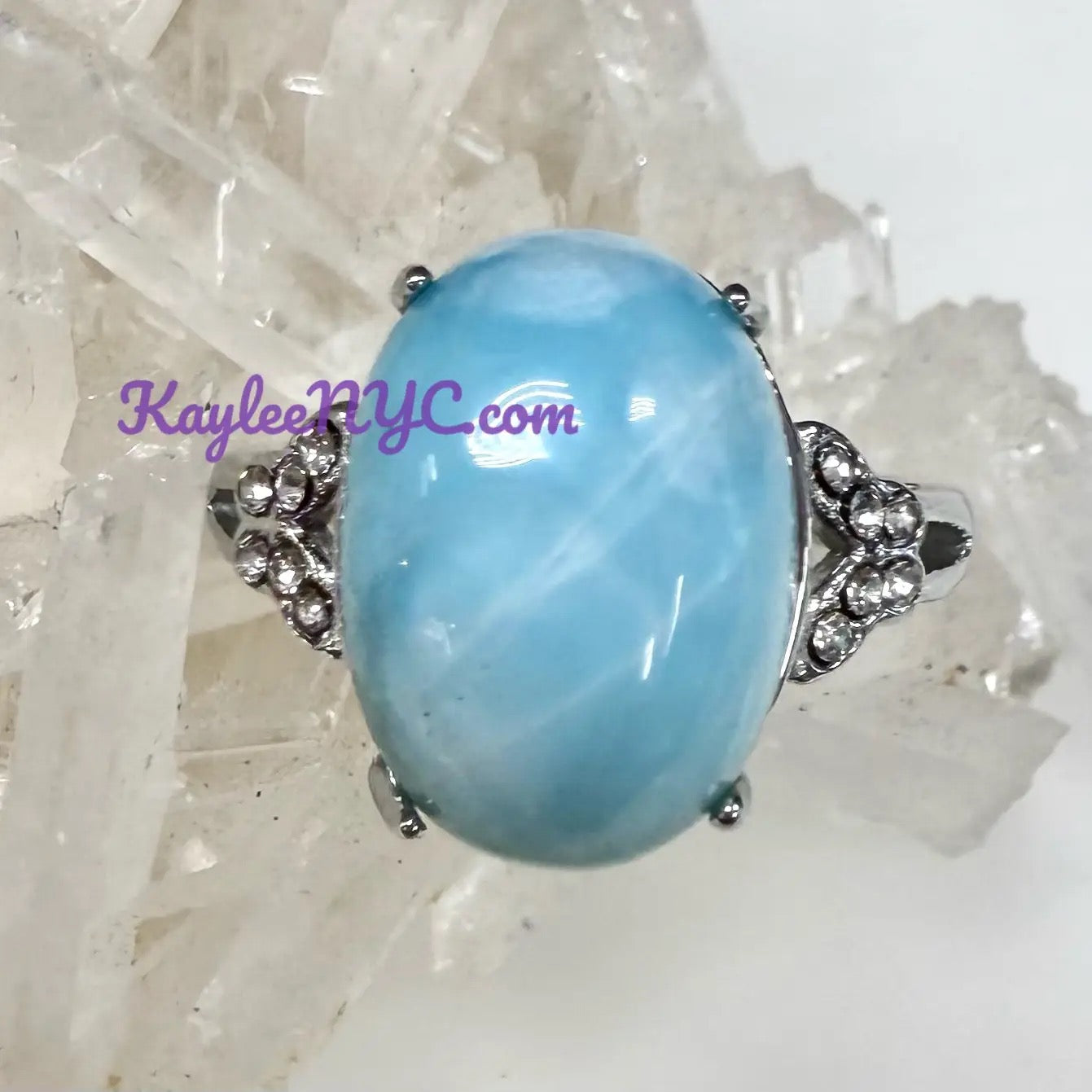 Ring with a large Larimar on a white background