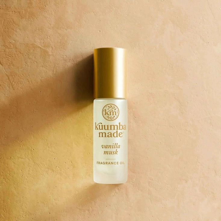 Kuumba Made vanilla musk fragrance oil bottle on a beige background