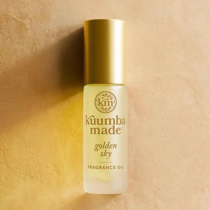 Köumba Made Golden Sky fragrance oil bottle on a beige background