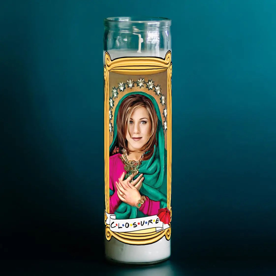 Candle with a portrait of a woman in a religious-style frame on a dark blue background