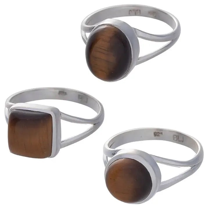 Three silver rings with brown tiger's eye stones, shown from different angles on a white background.