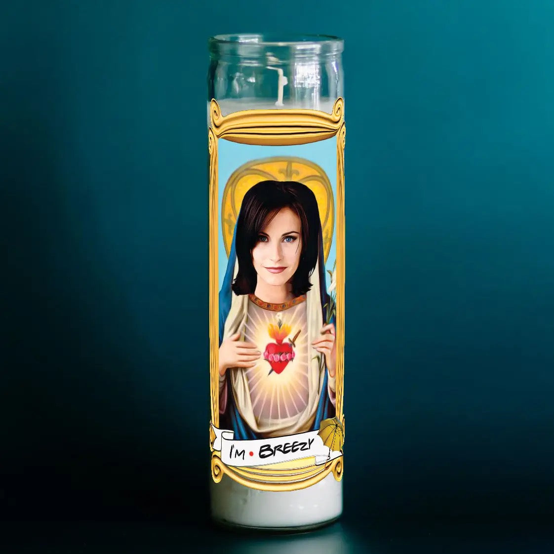 Candle with a portrait of a person holding a heart and the text 'I'm Breezy' on a dark background