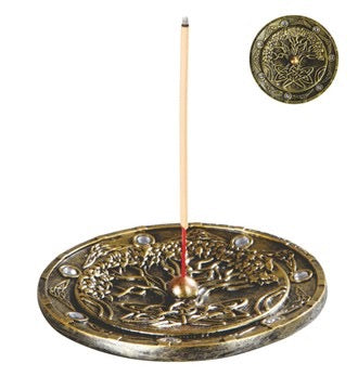 Decorative incense burner with a lit incense stick on a white background