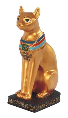 Gold cat statue with colorful collar on a white background