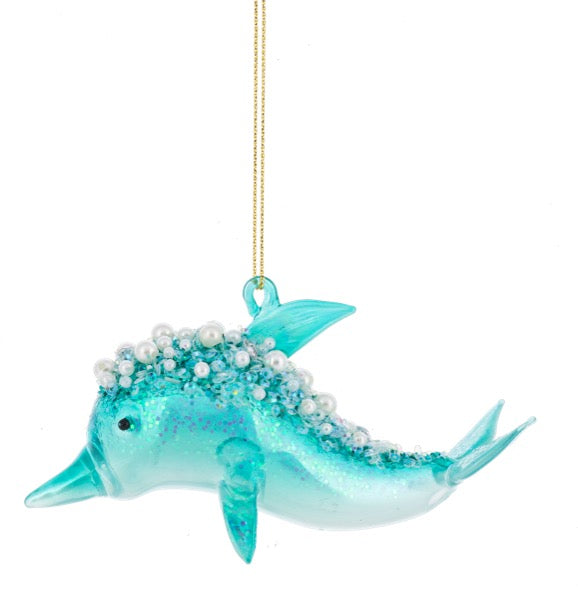 Decorative dolphin ornament with pearls on a white background