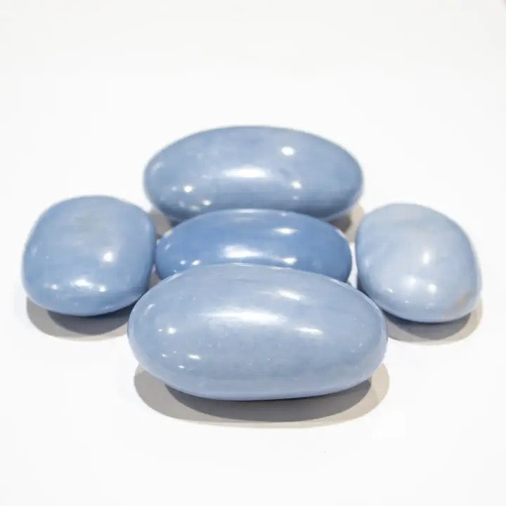 Angelite Palm Stone on a white background