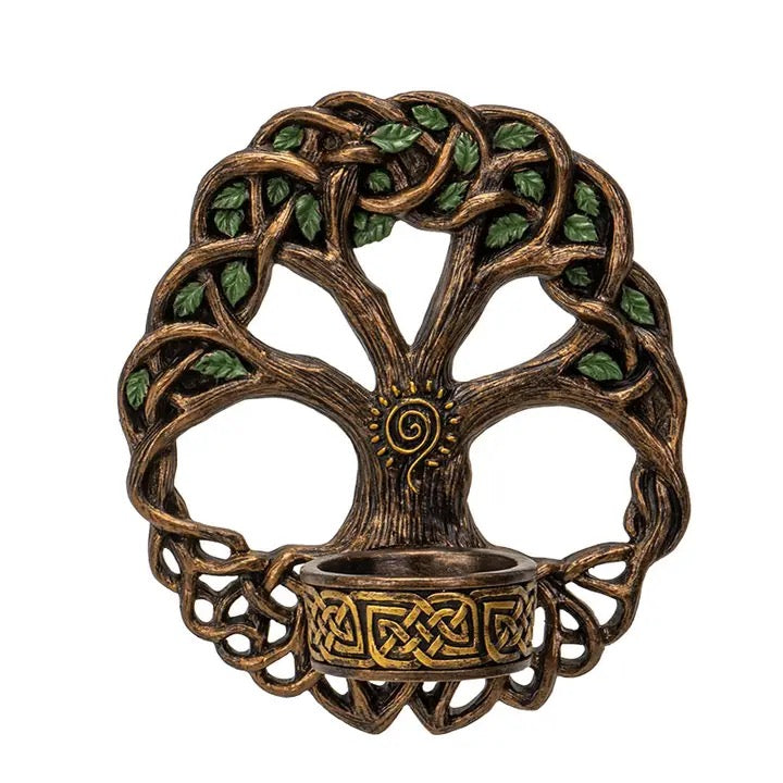 Decorative wall hook in the shape of a tree with green leaves on a white background