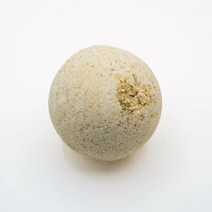 Bath bomb with natural ingredients on a white background