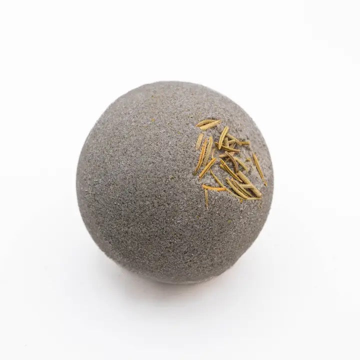 Gray stone ball with gold accents on a white background