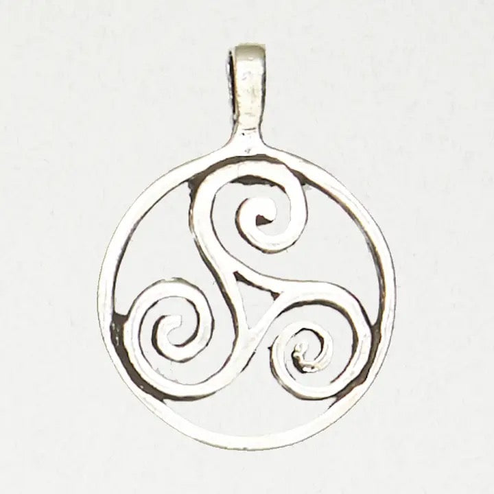 Silver triskele pendant on a white background