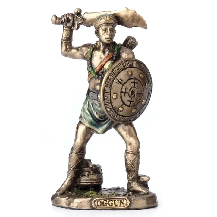 Statue of a warrior holding a sword and shield on a white background