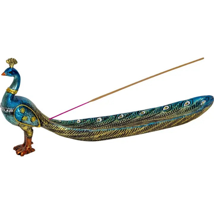 Decorative peacock-shaped incense holder with a single incense stick on a white background