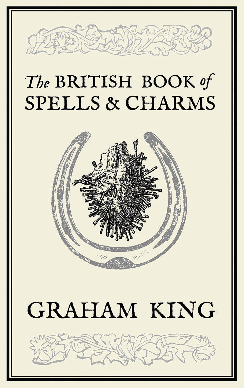 Book cover of 'The British Book of Spells & Charms' by Graham King with a horseshoe and star design.