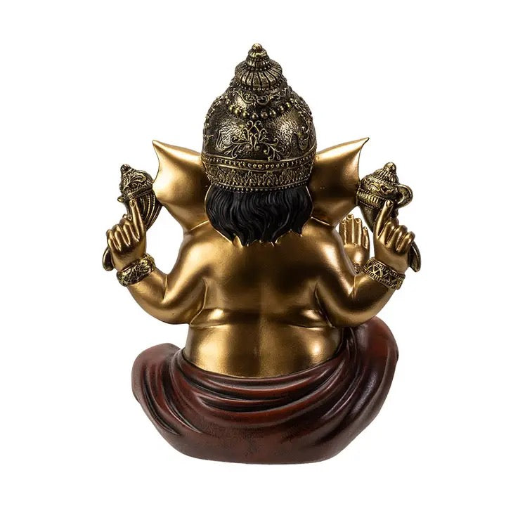 Statue of a deity with gold and brown colors on a white background