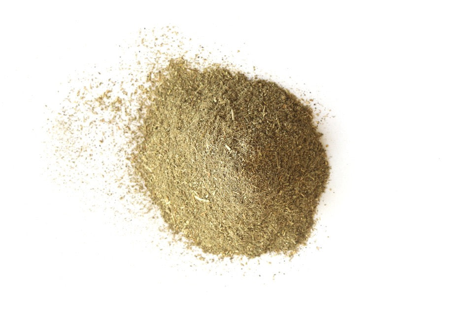Close-up of gold powder on a white background