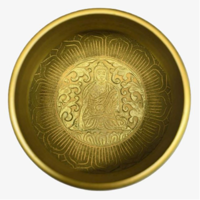 A round golden brass bowl with an embossed seated Buddha figure and floral motifs inside, shown against a plain light background.
