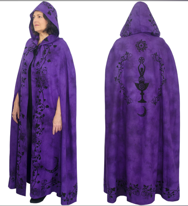 A purple hooded robe or cape with black printed occult-style designs, shown from the front and back on a white background. A woman is visible wearing the robe in the front view.