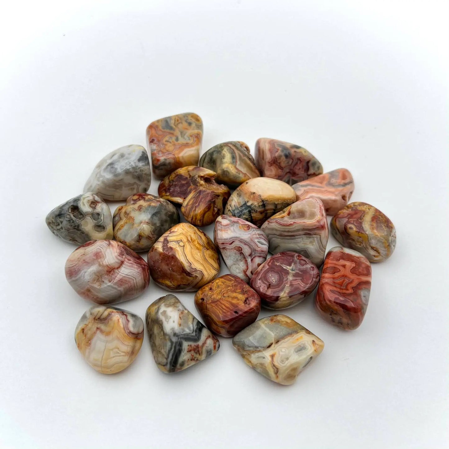 Red, yellow, white, and blacks tones with intricate swirled banding patterns.