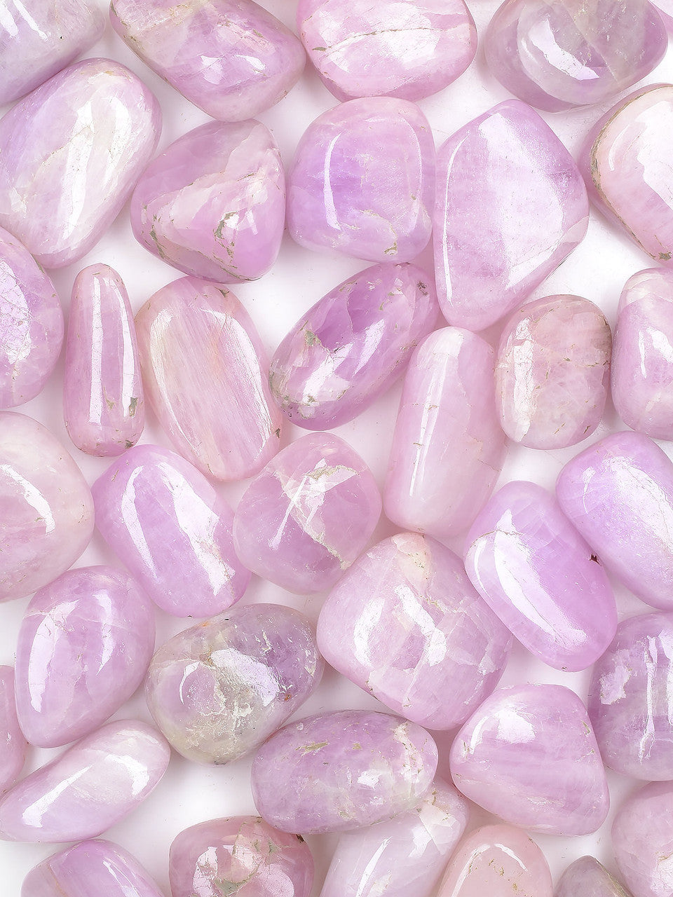 smooth pieces pieces of translucent tumbled stones in varying shades of purple, pink, and lavender